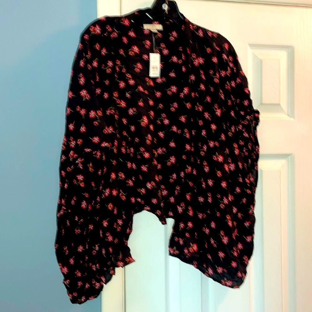 Loft shawl One size fits most.  Brand new with tags.  Black with floral print.